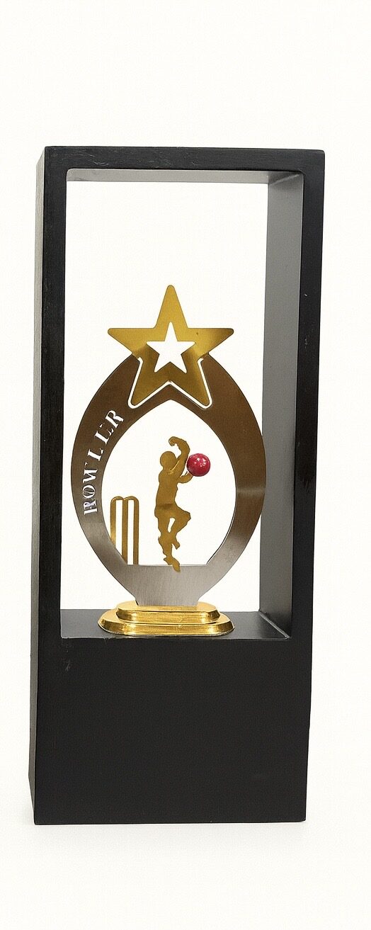 Best Bowler cricket trophy in a black wooden display case