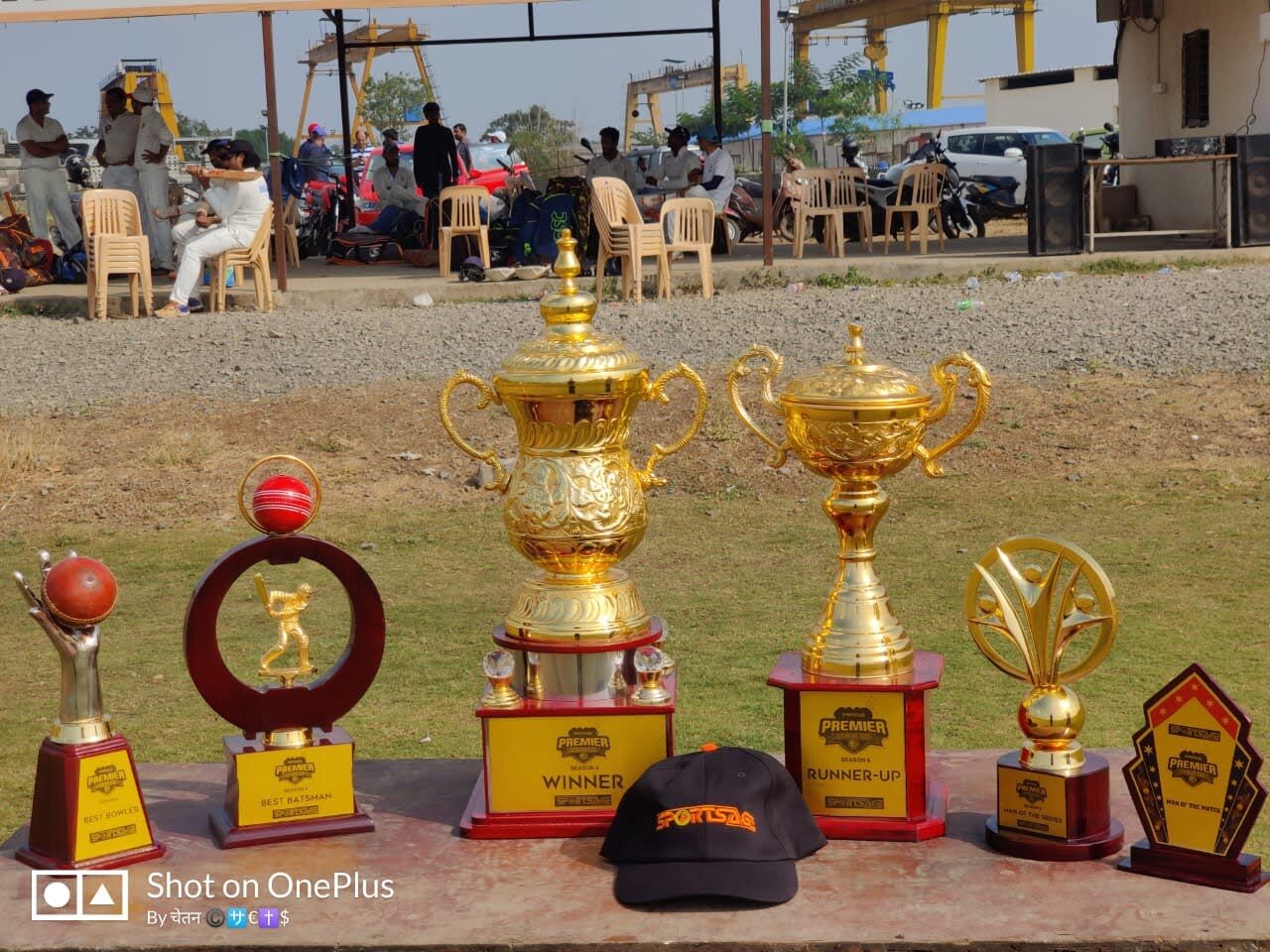 Tournament trophy set displayed at a corporate cricket final
